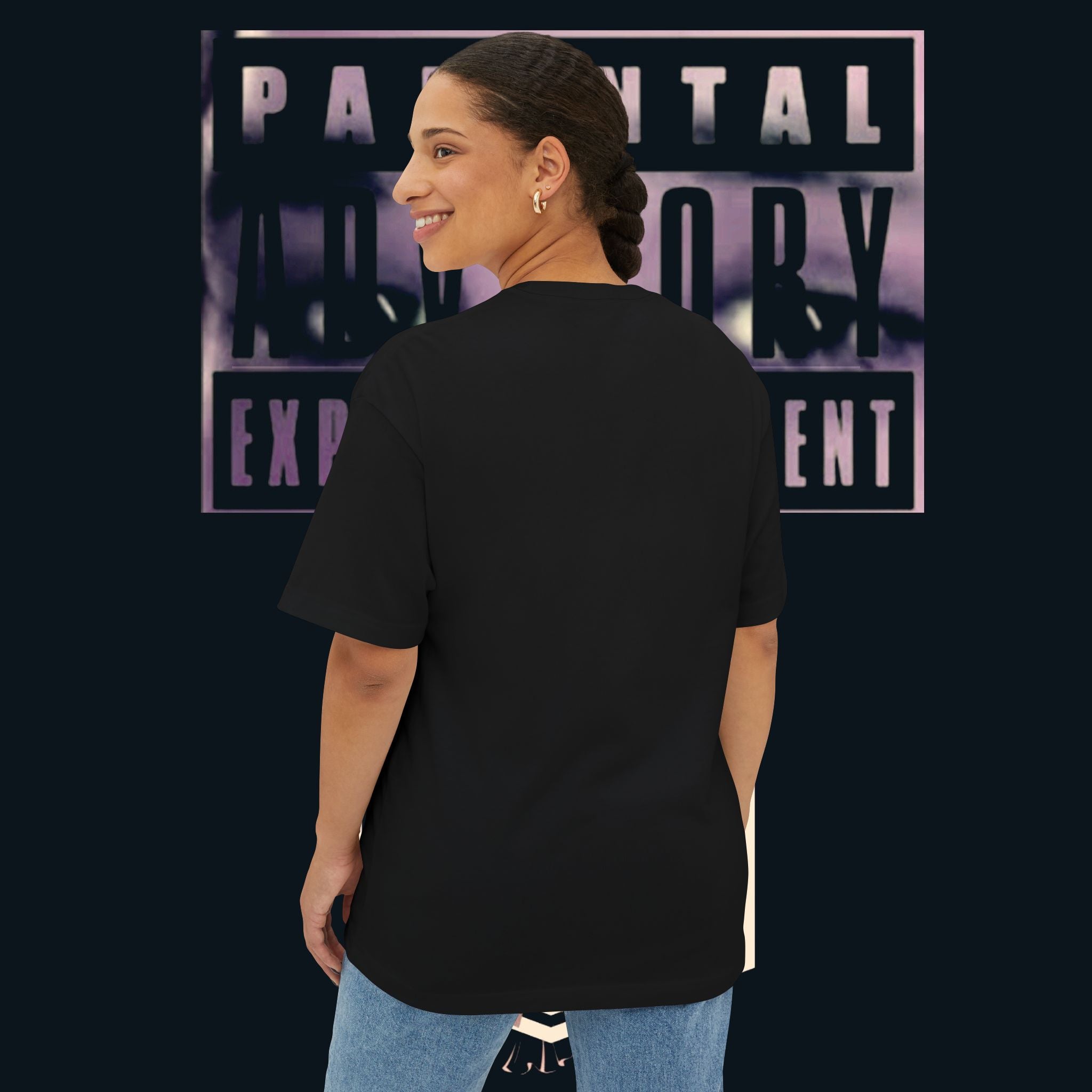 Model wearing the ‘xye’ Anime Eye Boxy Tee — "Parental Advisory" Graphic Oversized T-Shirt from the back.